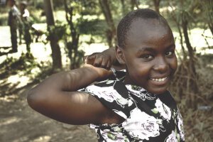 Dark Tones|Moody Green - A little girl. Tanzania