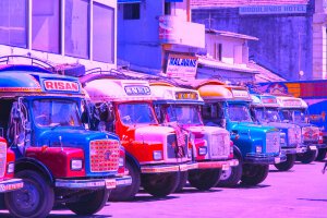 Stef Styles|Interior|Metro Station III Whitish - Some colourful busses. Colombo / Sri Lanka