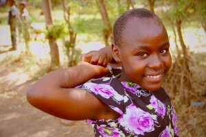 Stef Styles|The Traveller|Tropical Beach 70s - A little girl. Tanzania